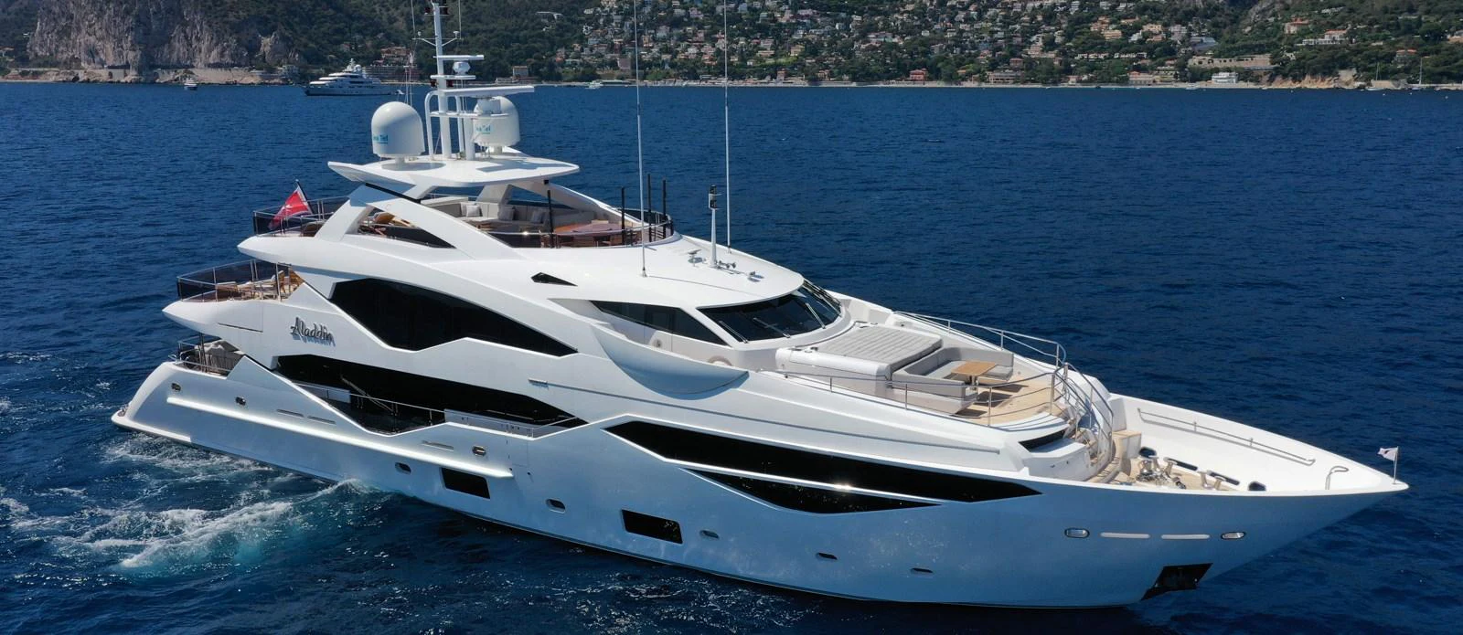 a white yacht on the water aboard ALADDIN Yacht for Sale
