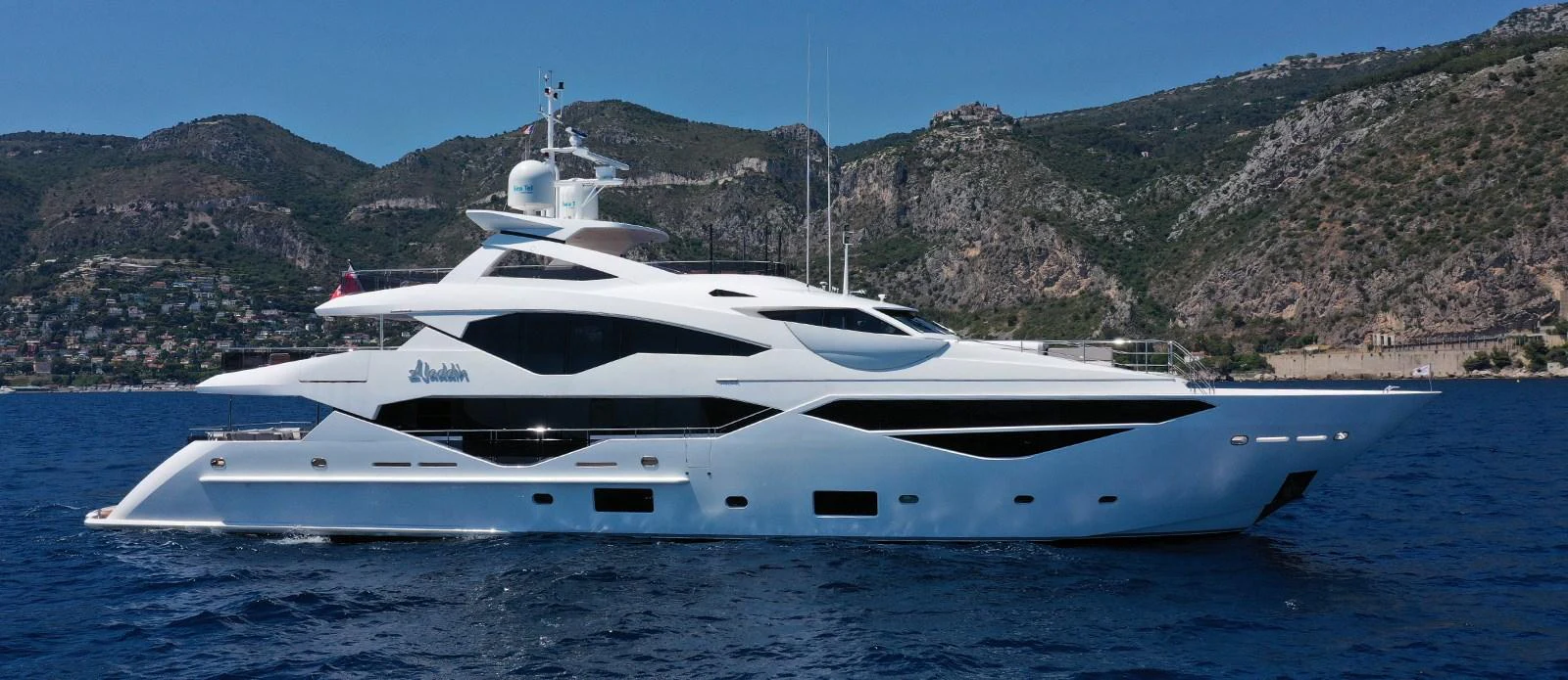 a white yacht on the water aboard ALADDIN Yacht for Sale