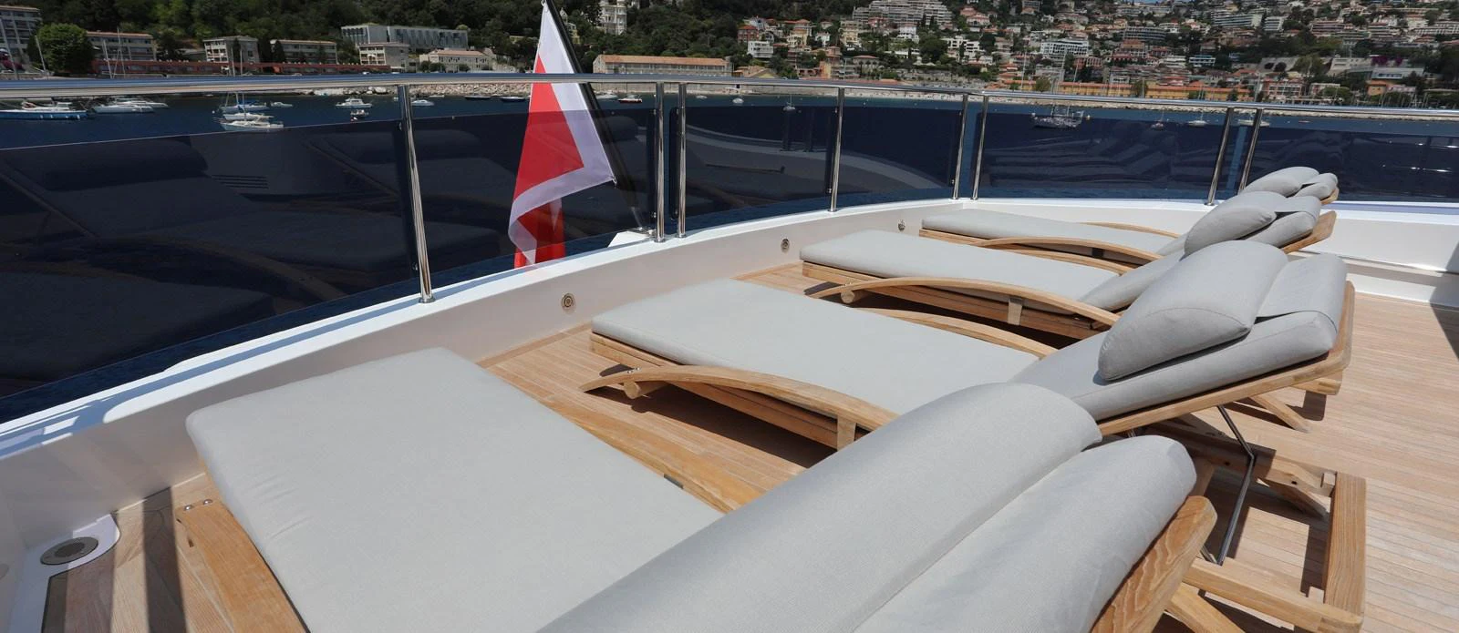 a deck with a flag on it aboard ALADDIN Yacht for Sale