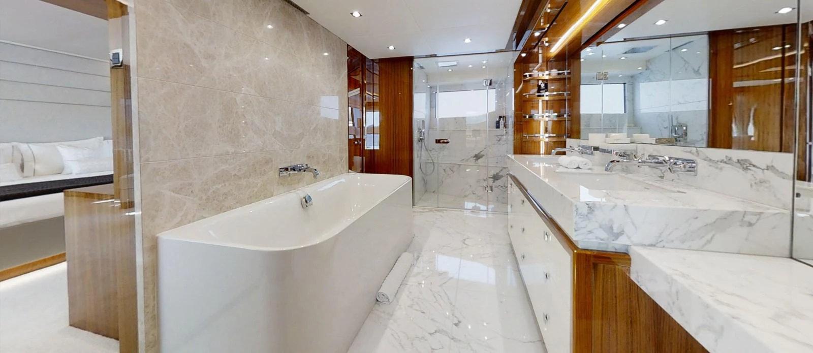 a bathroom with a bathtub and sinks aboard ALADDIN Yacht for Sale