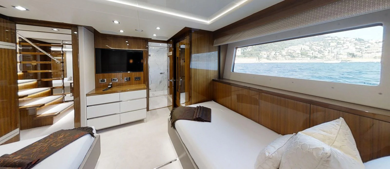 a room with a bed and a tv aboard ALADDIN Yacht for Sale