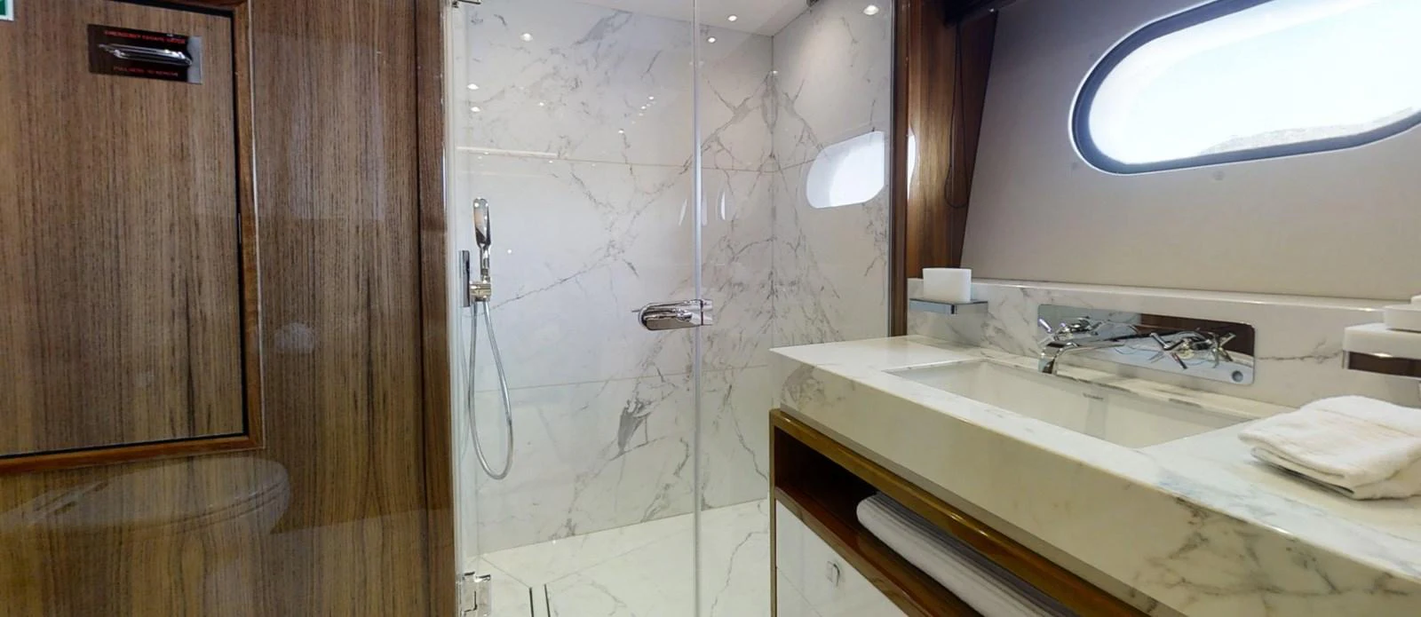a bathroom with a sink and a window aboard ALADDIN Yacht for Sale