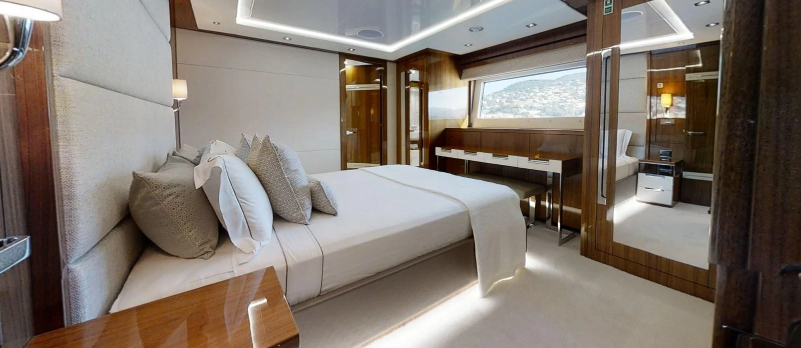 a room with a bed and a desk aboard ALADDIN Yacht for Sale