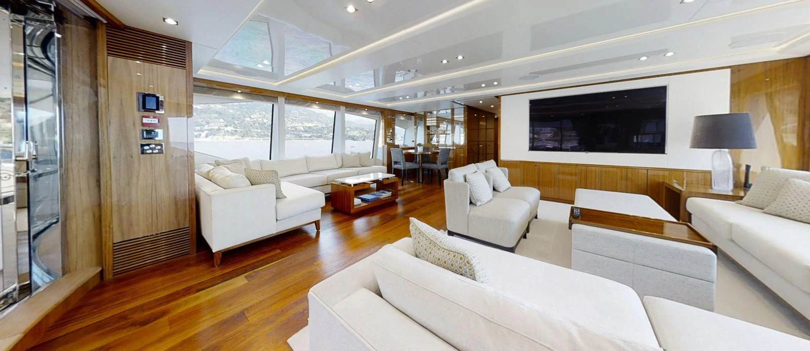 a living room with a wood floor aboard ALADDIN Yacht for Sale