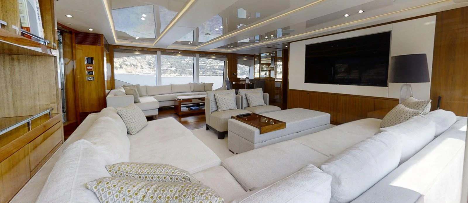 a living room with a large screen aboard ALADDIN Yacht for Sale