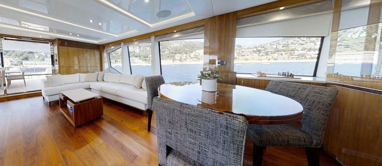 a living room with a large table and chairs aboard ALADDIN Yacht for Sale