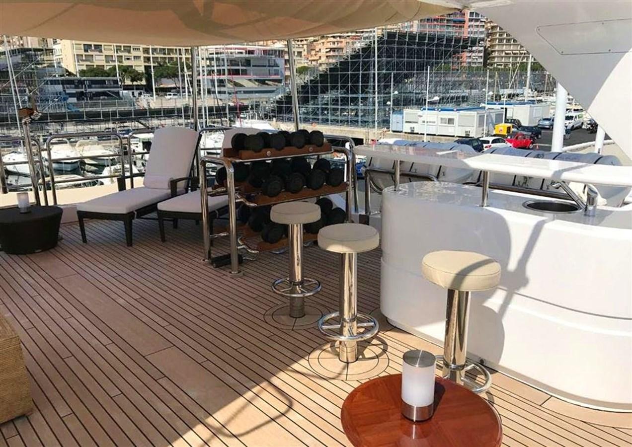 a table with chairs on it aboard VIRTUE Yacht for Sale
