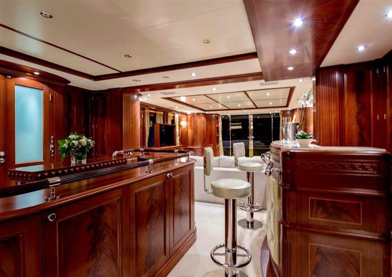 a kitchen with wooden cabinets aboard VIRTUE Yacht for Sale