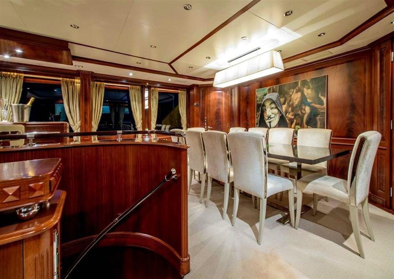 a restaurant with tables and chairs aboard VIRTUE Yacht for Sale
