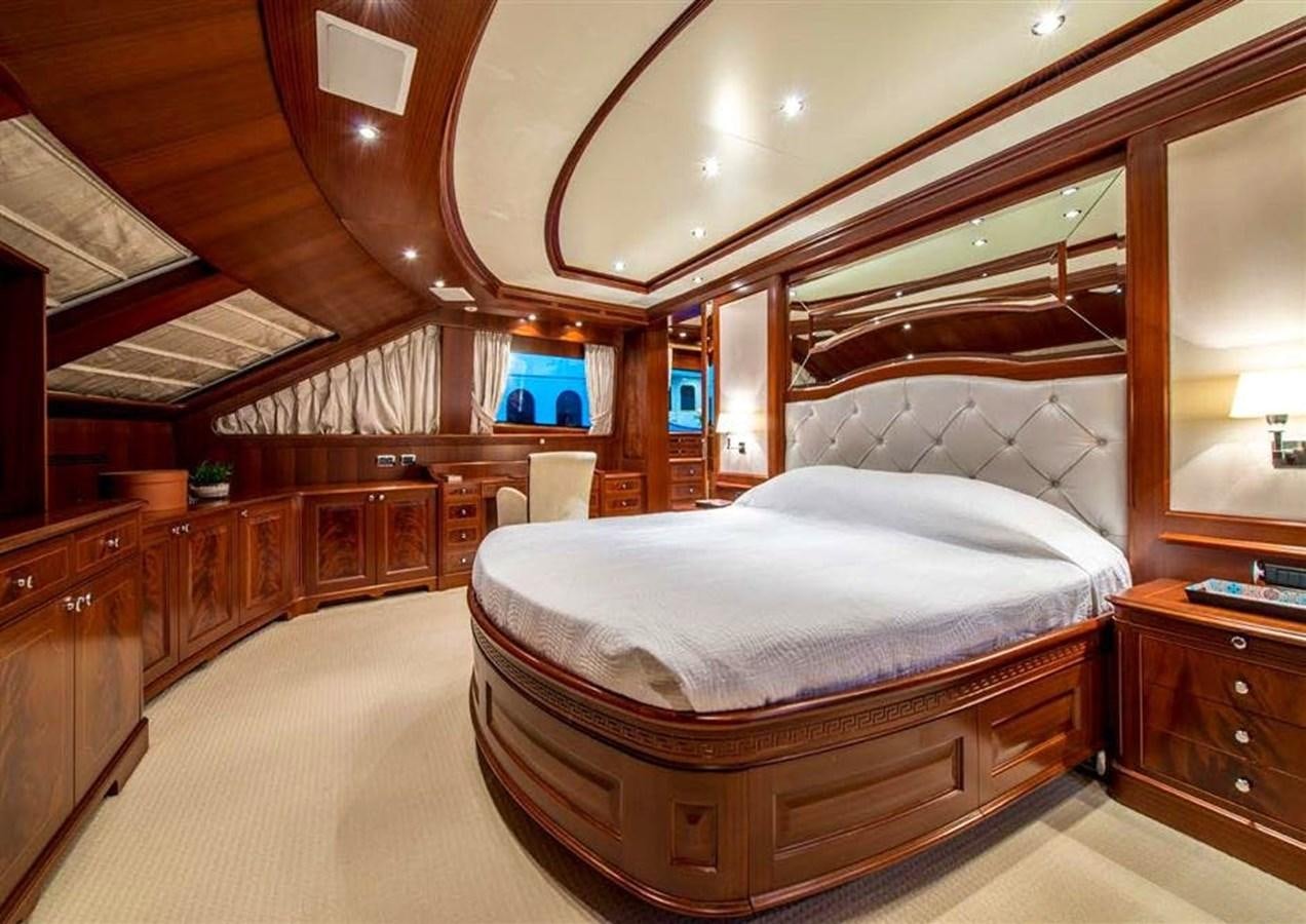 a bedroom with a large bed aboard VIRTUE Yacht for Sale