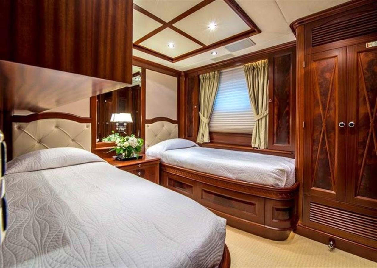 a bedroom with two beds aboard VIRTUE Yacht for Sale