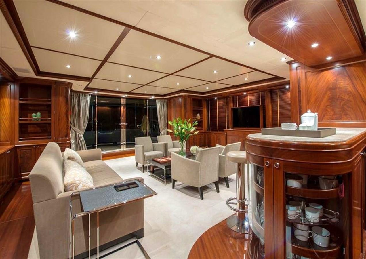 a living room with a table and chairs aboard VIRTUE Yacht for Sale