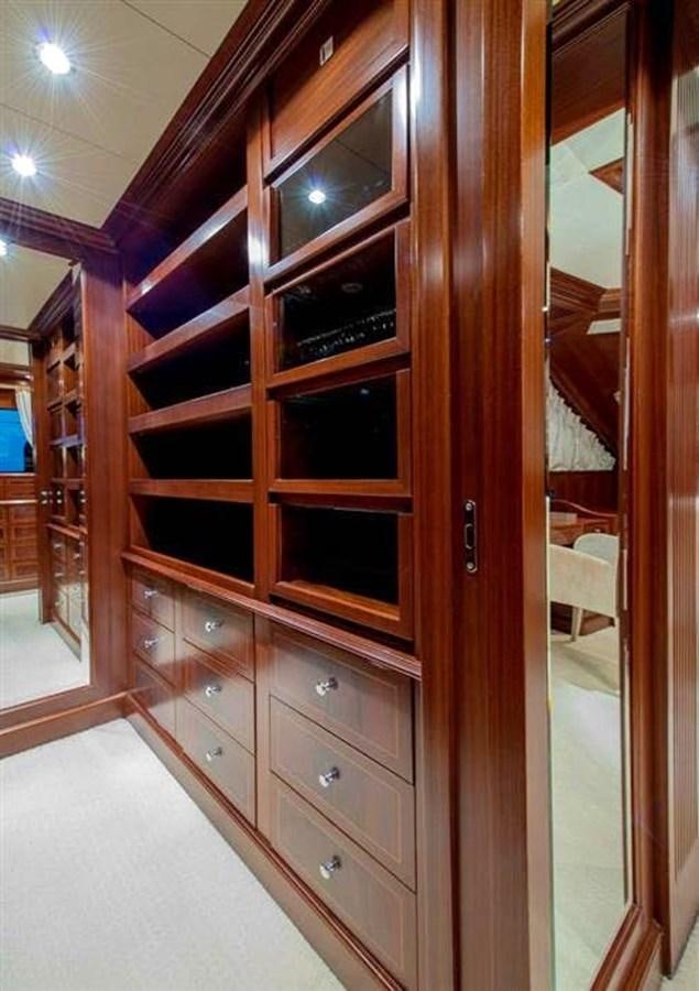 a wooden cabinet with drawers aboard VIRTUE Yacht for Sale