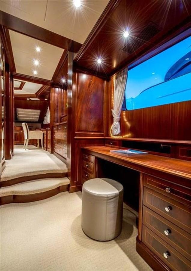a room with a bed and a tv aboard VIRTUE Yacht for Sale