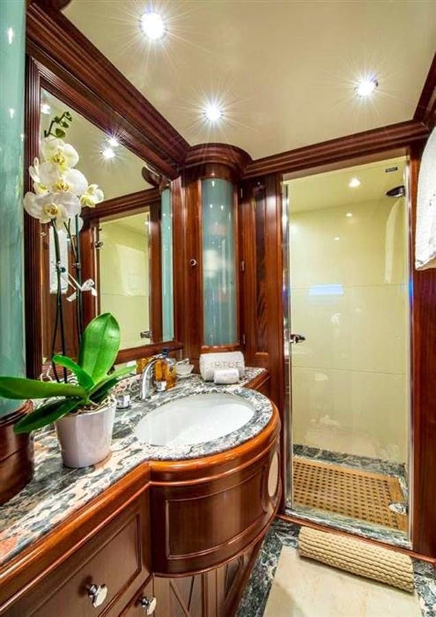 a bathroom with a sink and a mirror aboard VIRTUE Yacht for Sale