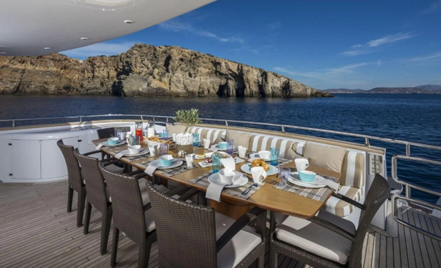 a table set for a meal on a boat aboard MAIORA 35 DP Yacht for Sale