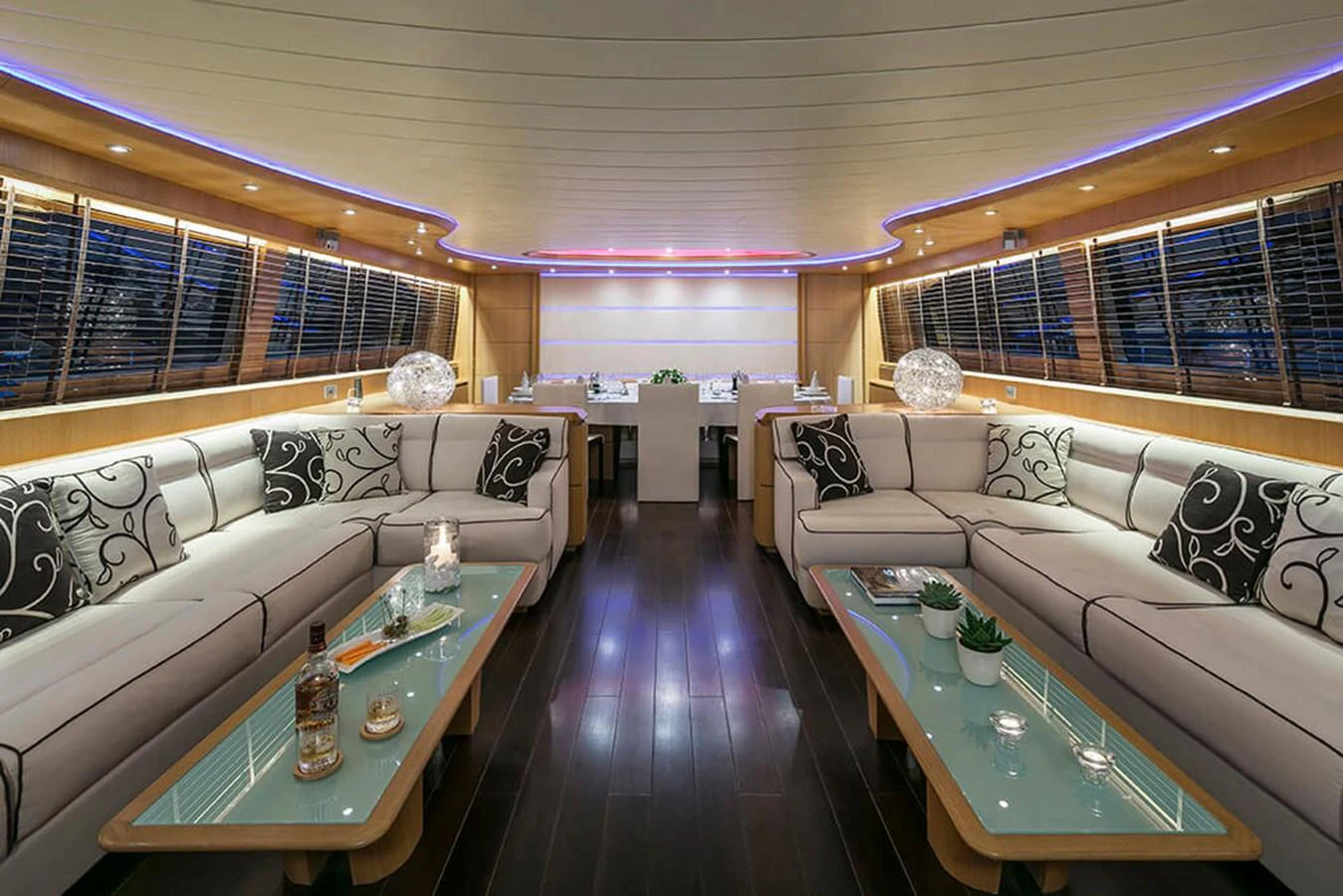 a living room with a couch and a coffee table aboard MAIORA 35 DP Yacht for Sale