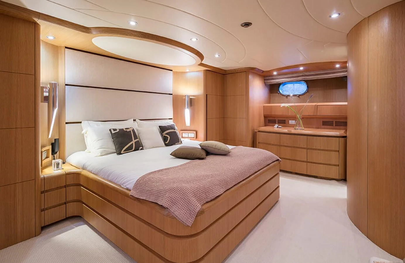 a room with a bed and a desk aboard MAIORA 35 DP Yacht for Sale