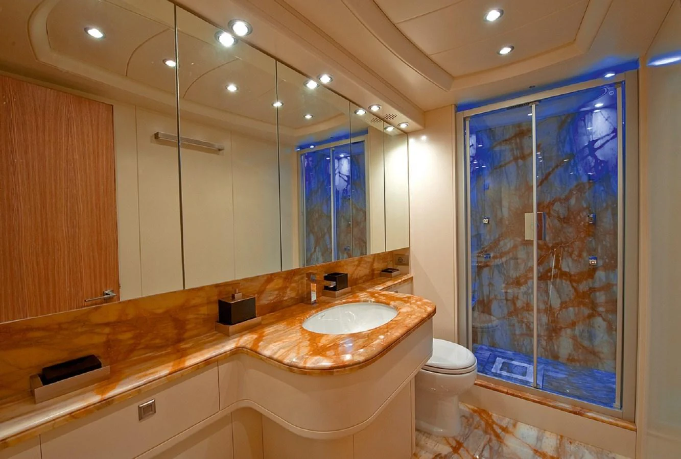 a bathroom with a glass shower aboard MAIORA 35 DP Yacht for Sale