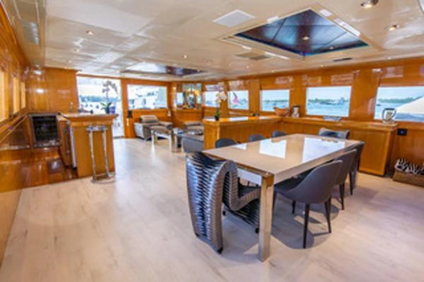 a large room with tables and chairs aboard 2000 116 BAGLIETTO Yacht for Sale