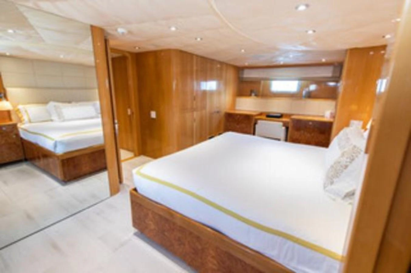 a room with a bed and a desk aboard 2000 116 BAGLIETTO Yacht for Sale