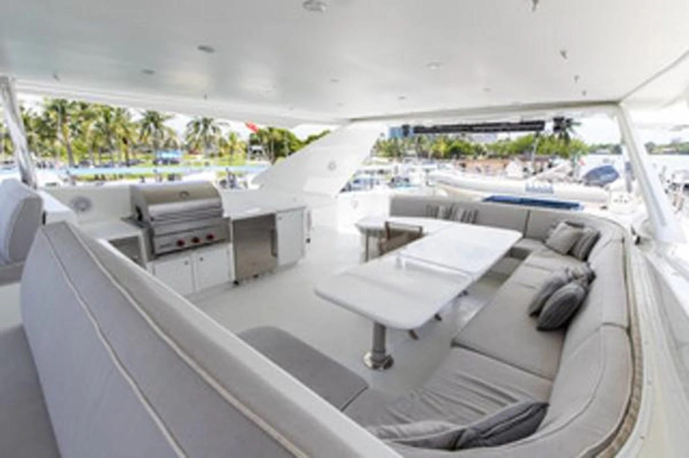 a room with a bed and a desk with a chair and a table aboard 2000 116 BAGLIETTO Yacht for Sale