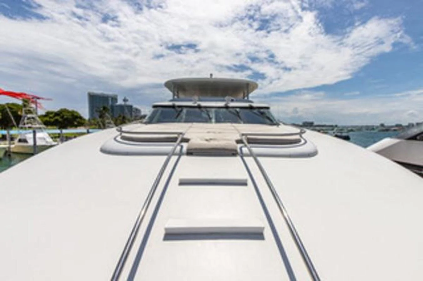 a white boat on a dock aboard 2000 116 BAGLIETTO Yacht for Sale