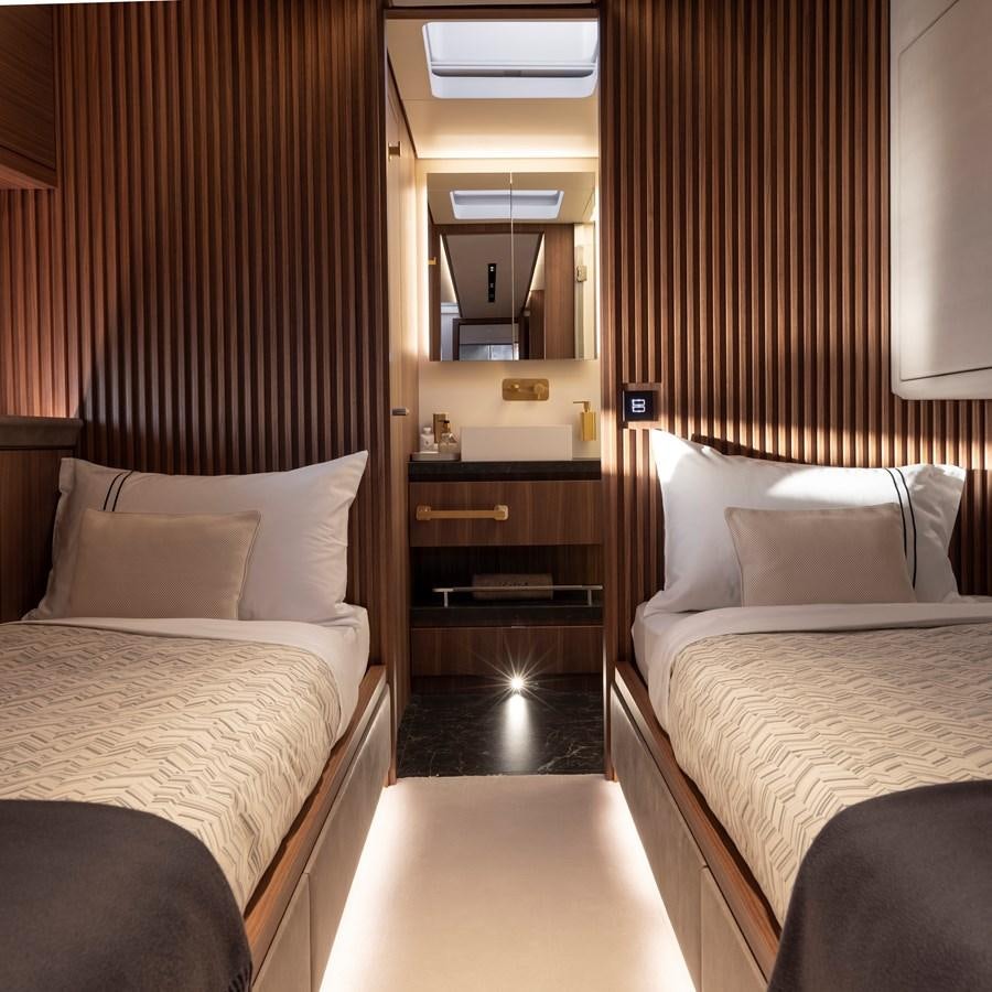 a room with a bed and a mirror aboard CEFEA Yacht for Charter