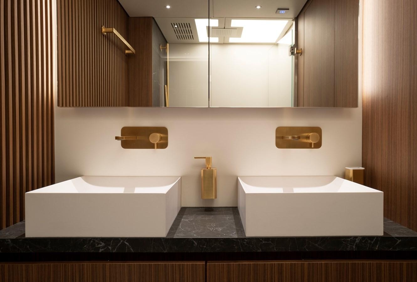 a bathroom with a large mirror aboard CEFEA Yacht for Charter