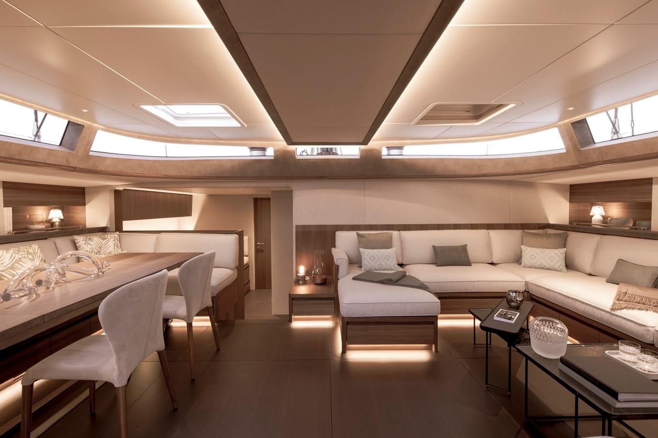 a room with a couch and a table aboard CEFEA Yacht for Charter