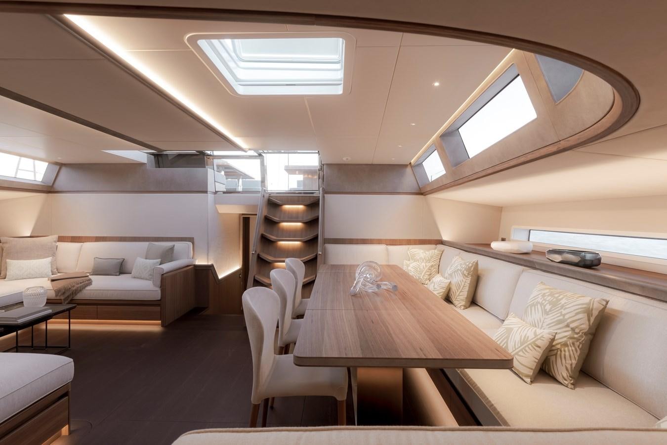 a room with a couch and a table and a bed aboard CEFEA Yacht for Charter