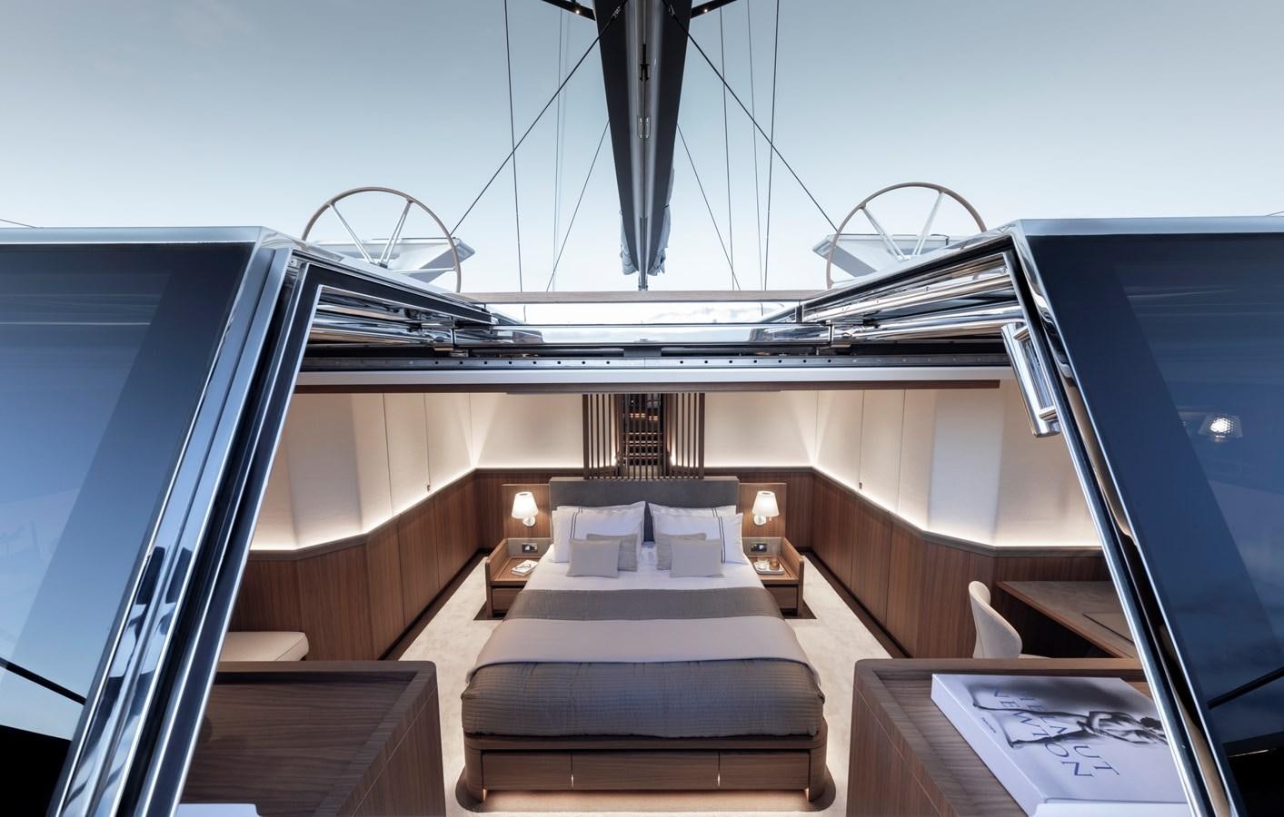 a room with a bed and a ferris wheel aboard CEFEA Yacht for Charter