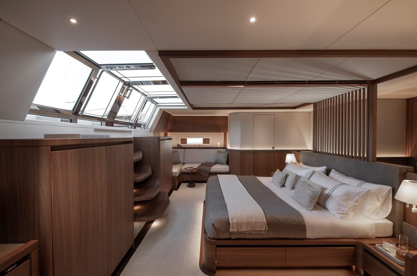 a room with a bed and a couch aboard CEFEA Yacht for Sale