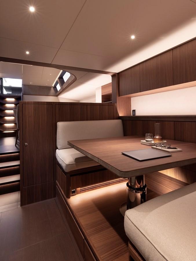a room with a table and chairs aboard CEFEA Yacht for Charter