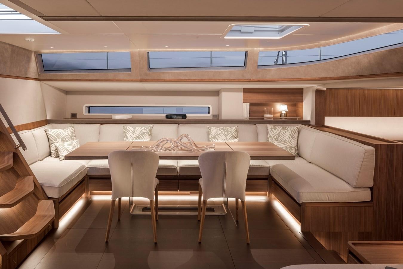 a room with couches and a table aboard CEFEA Yacht for Charter