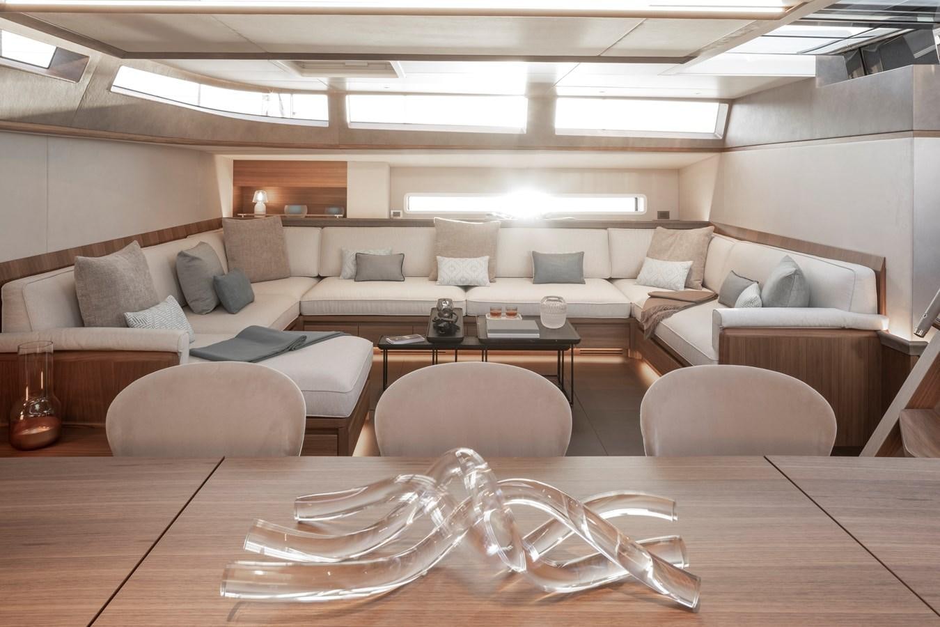 a living room with a table and chairs aboard CEFEA Yacht for Charter