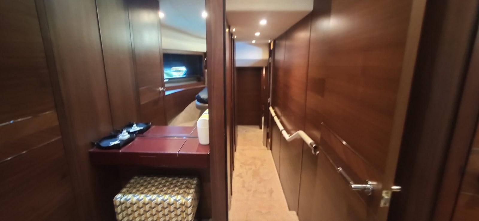 a room with a table and a tv aboard ANOTHER TOY Yacht for Sale