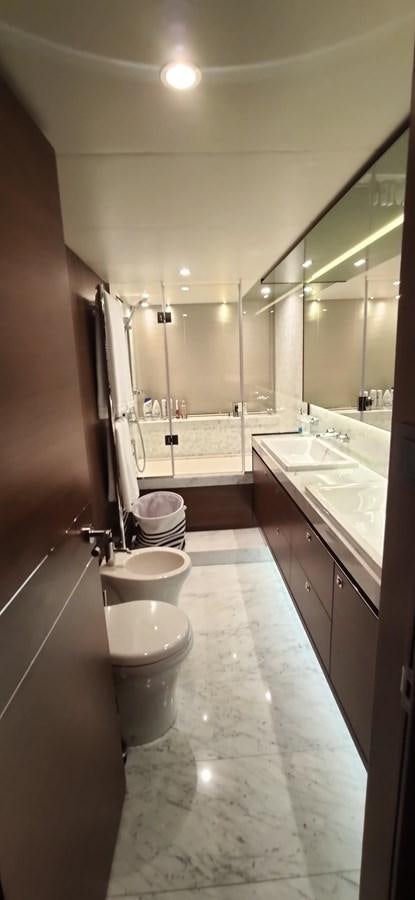 a bathroom with a large mirror aboard ANOTHER TOY Yacht for Sale