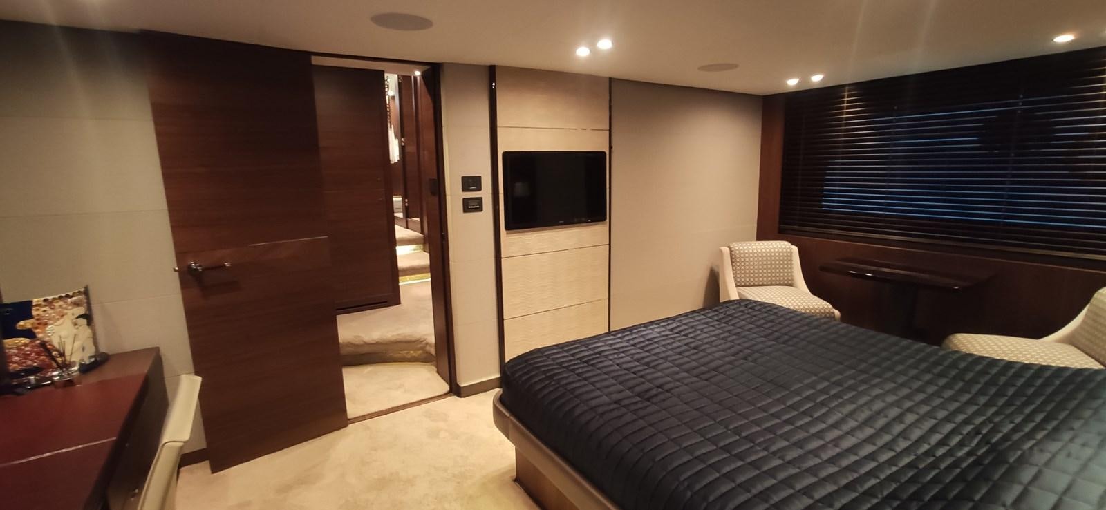 a hotel room with a bed and tv aboard ANOTHER TOY Yacht for Sale