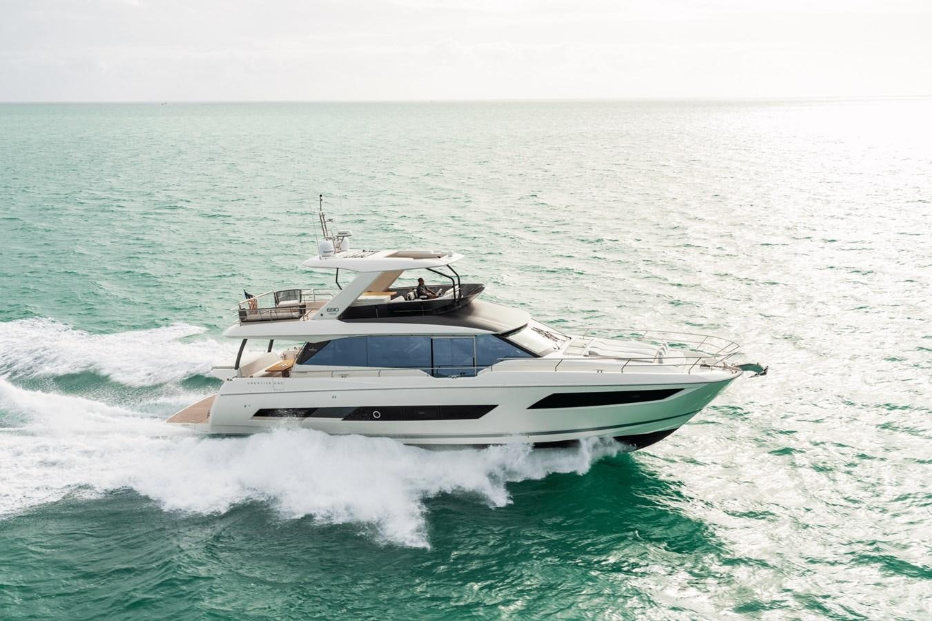 a boat on the water aboard 2021 PRESTIGE YACHTS 690 FLYBRIDGE Yacht for Sale