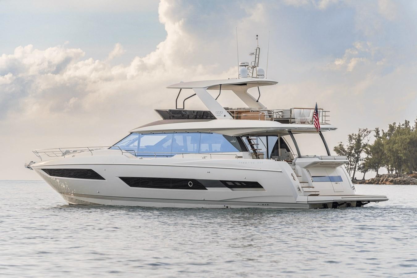 a white boat on the water aboard 2021 PRESTIGE YACHTS 690 FLYBRIDGE Yacht for Sale