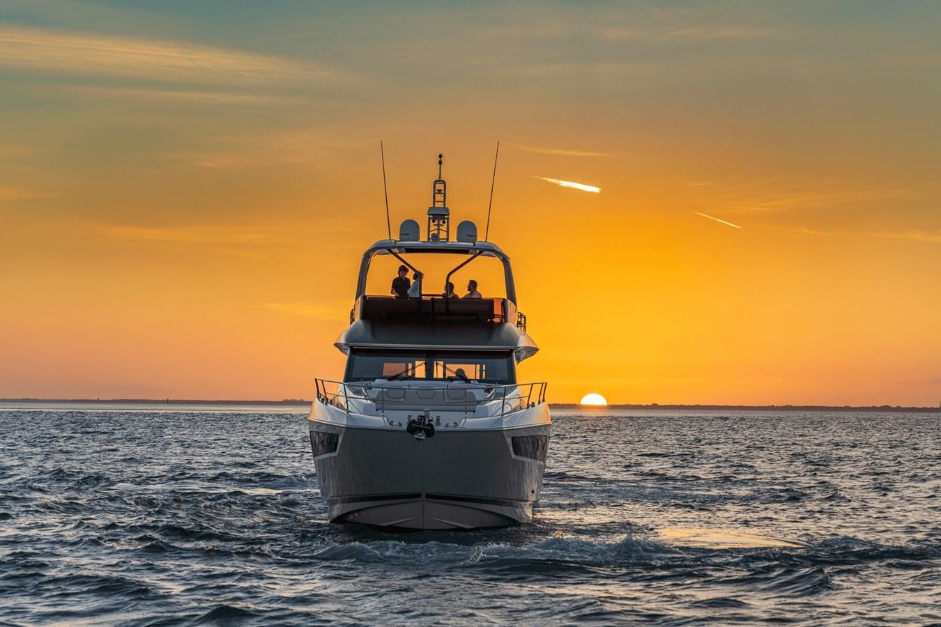 a boat in the water aboard 2021 PRESTIGE YACHTS 690 FLYBRIDGE Yacht for Sale