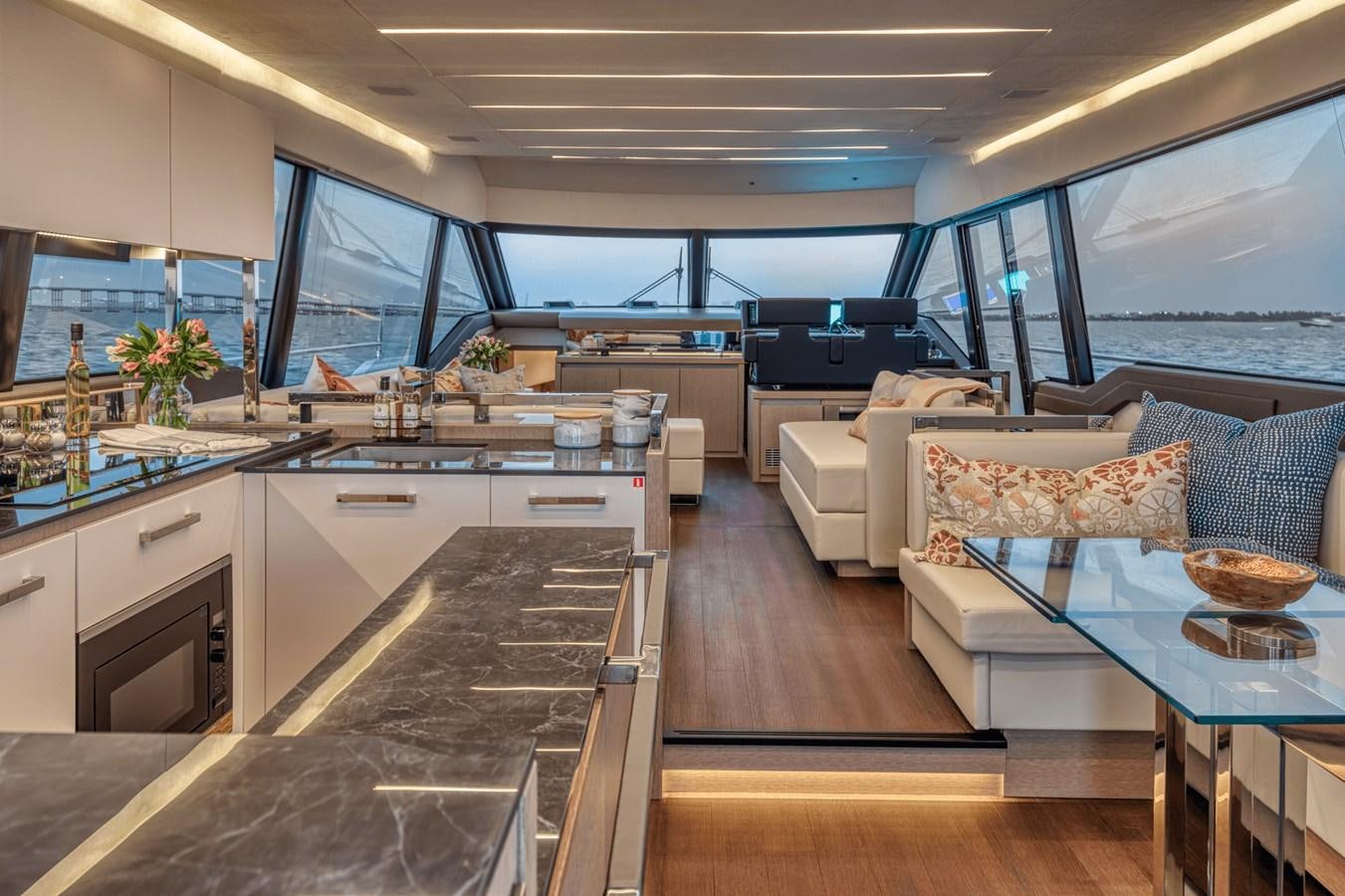 a modern looking kitchen with a large open window aboard 2021 PRESTIGE YACHTS 690 FLYBRIDGE Yacht for Sale