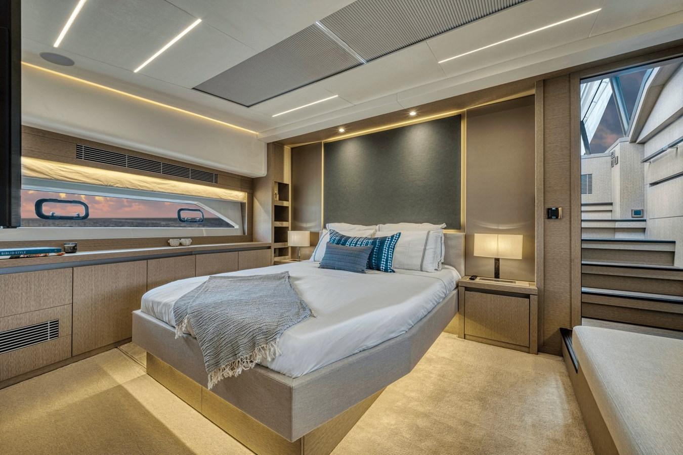 a room with a bed and a television aboard 2021 PRESTIGE YACHTS 690 FLYBRIDGE Yacht for Sale