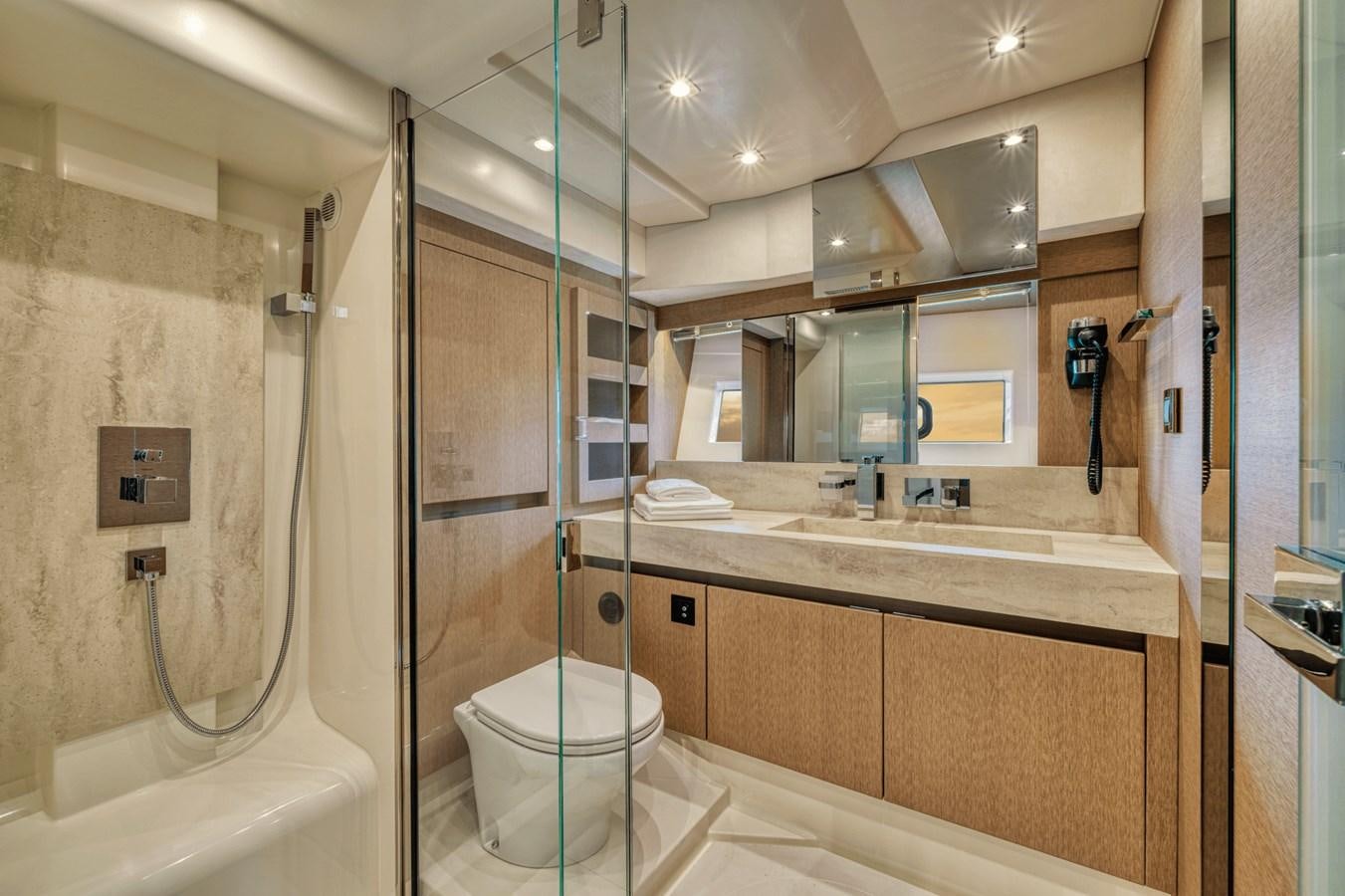 a bathroom with a glass shower aboard 2021 PRESTIGE YACHTS 690 FLYBRIDGE Yacht for Sale