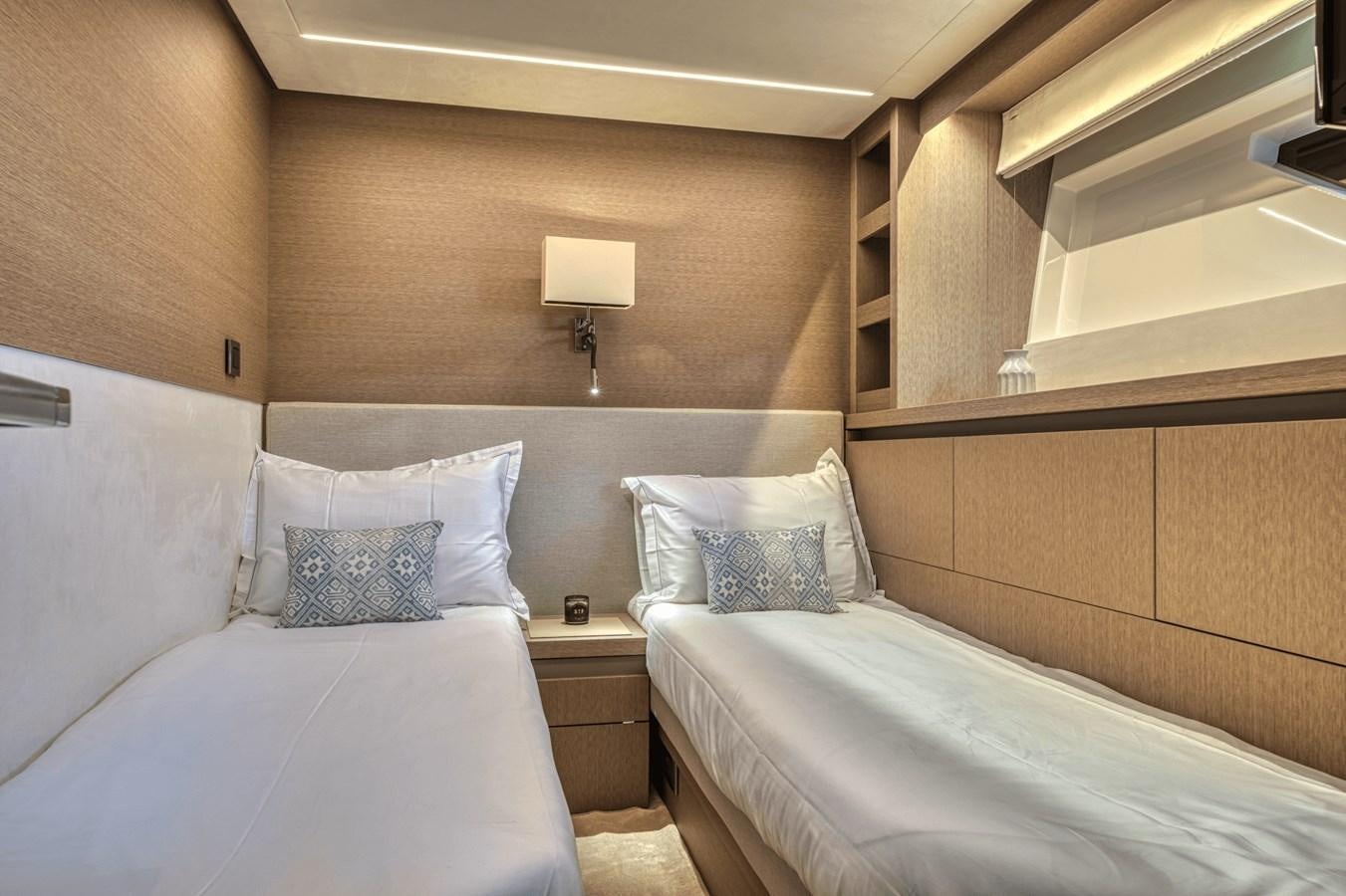 a room with two beds aboard 2021 PRESTIGE YACHTS 690 FLYBRIDGE Yacht for Sale