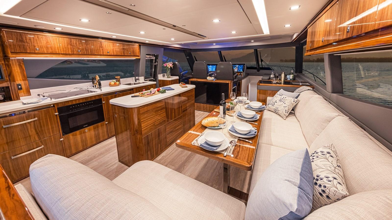 a living room with a couch and a table aboard 645 SUV Yacht for Sale