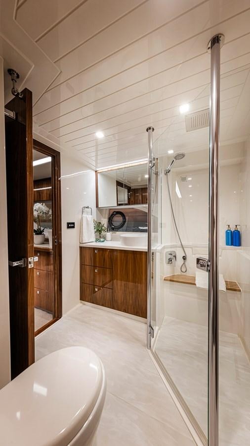 a bathroom with a glass shower aboard 645 SUV Yacht for Sale