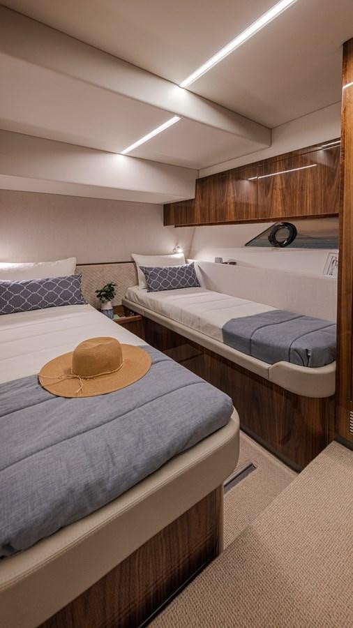a room with two beds aboard 645 SUV Yacht for Sale