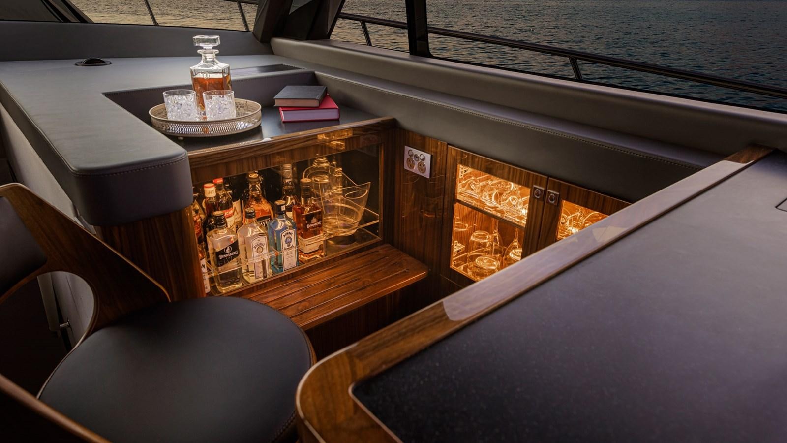 a boat with a table and a tray of food on it aboard 645 SUV Yacht for Sale
